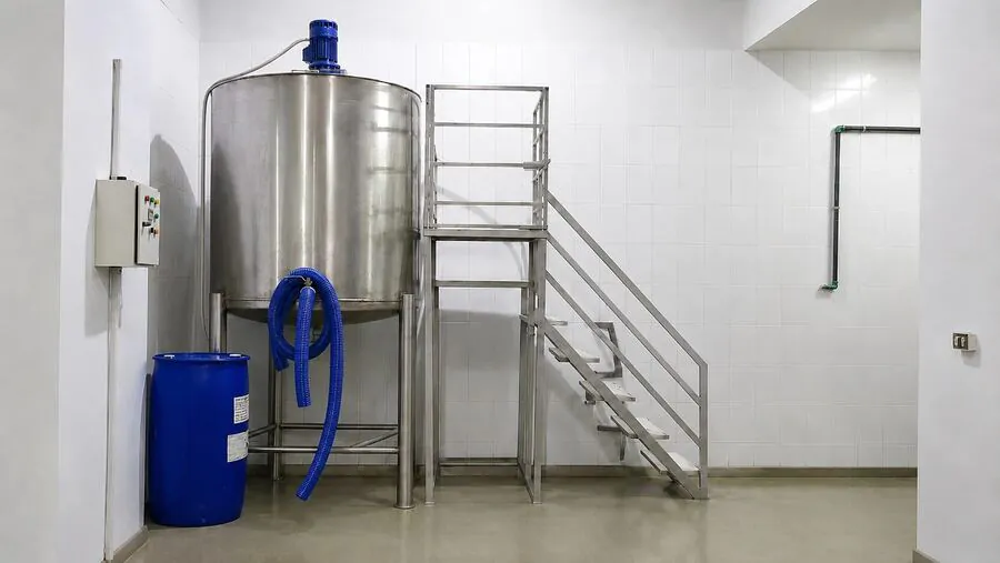Stainless-steel blending tank with agitator and access platform