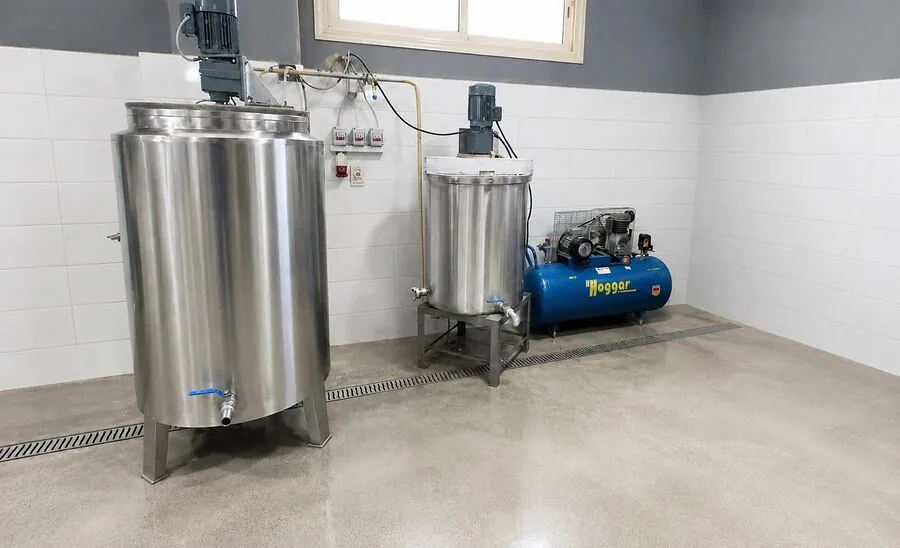 Two agitated stainless-steel mixing tanks